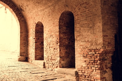 AIhistory - a row of arches on a brick wall